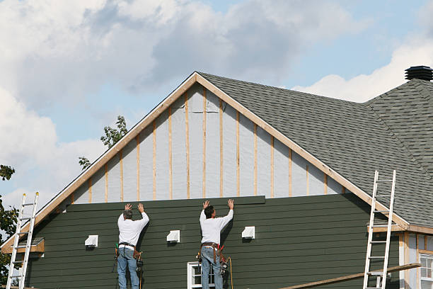 Professional Siding technician working in Arona, PA